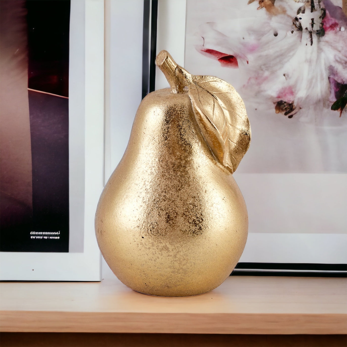 Pear sculpture in Gold colour.