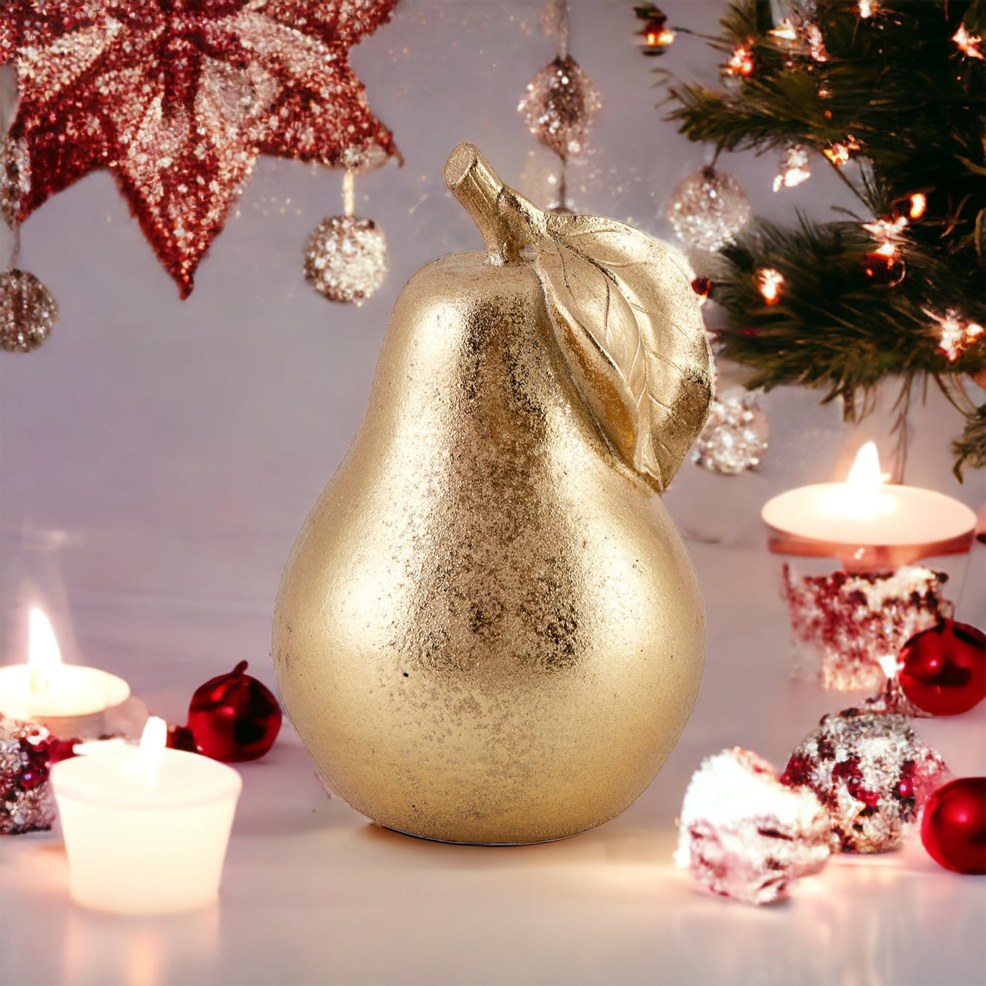 Pear sculpture in Gold colour.